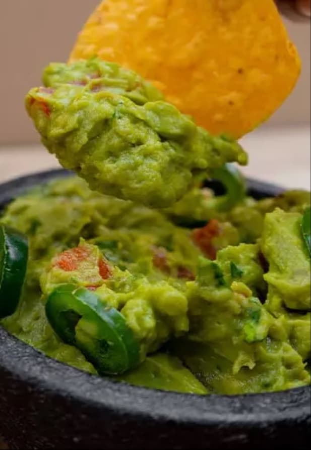 Chicken enchiladas served with beans and rice